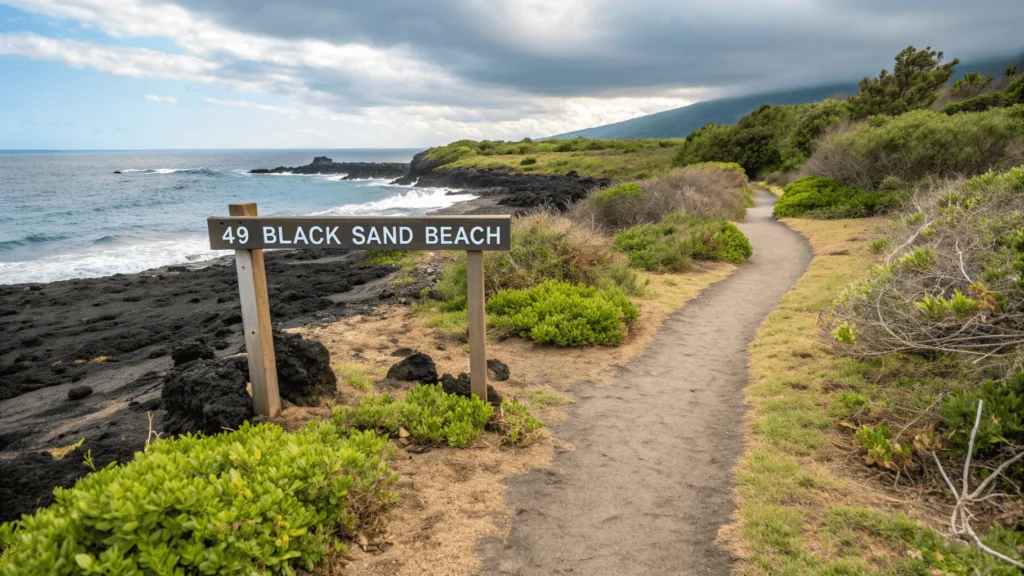 Public access path to 49 Black Sand Beach winding through lava rock with directional signage