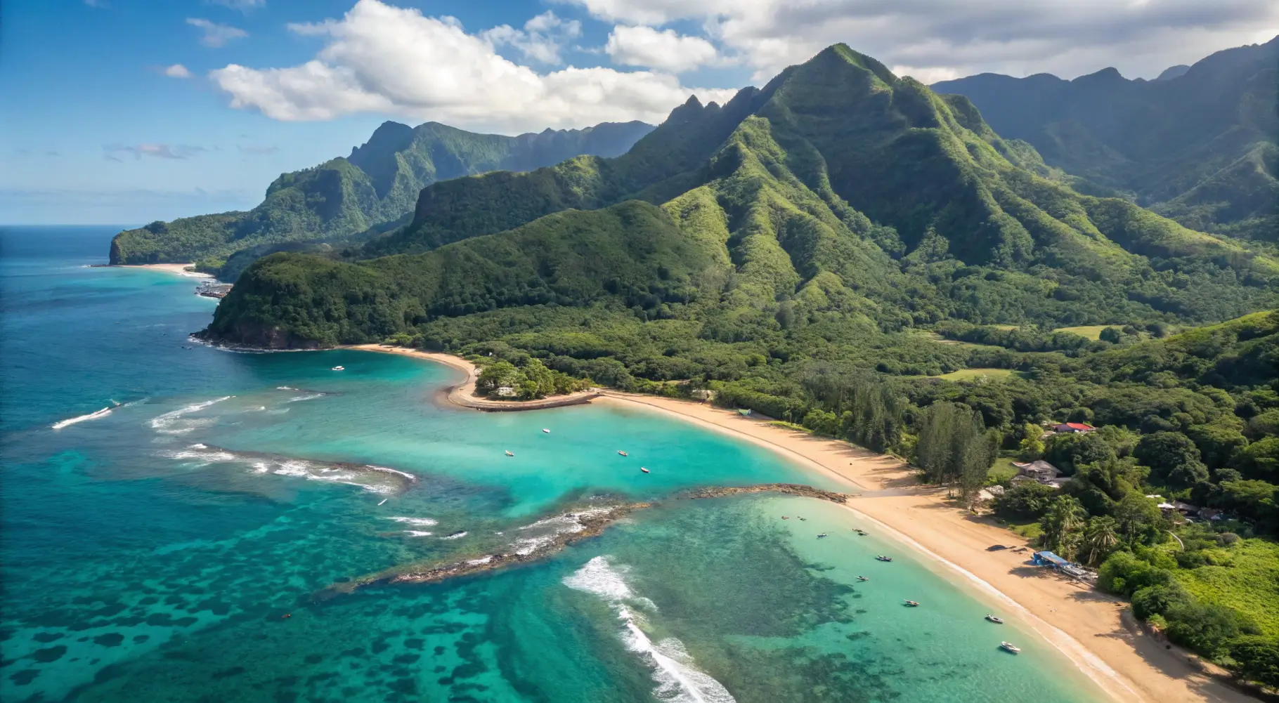Aerial view of Tunnels Beach in Kauai, featuring turquoise waters, coral reefs, and snorkelers enjoying the vibrant marine life.