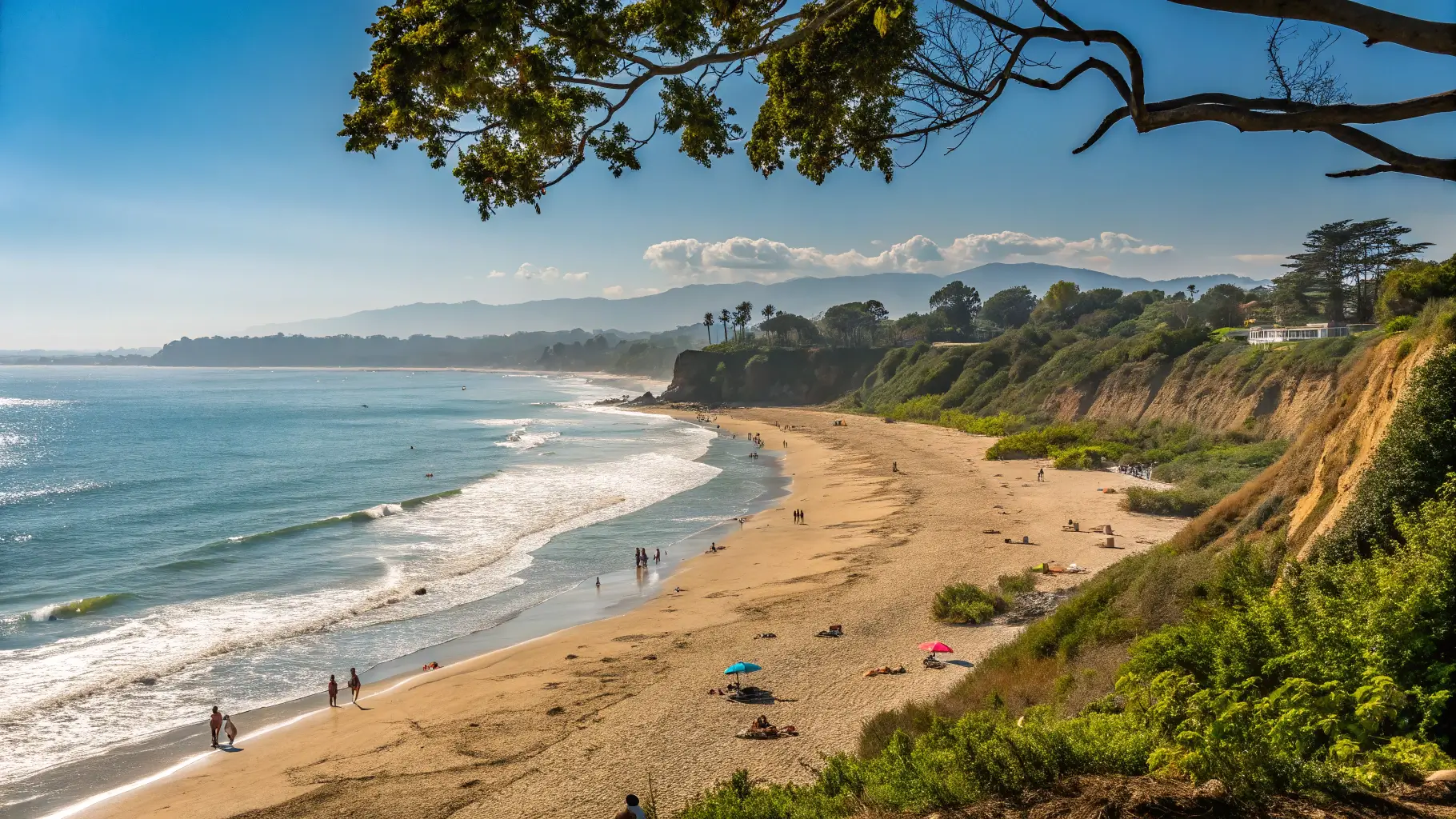 A picturesque scene of Butterfly Beach in Montecito, featuring golden sands, gentle waves, and families enjoying the beach.